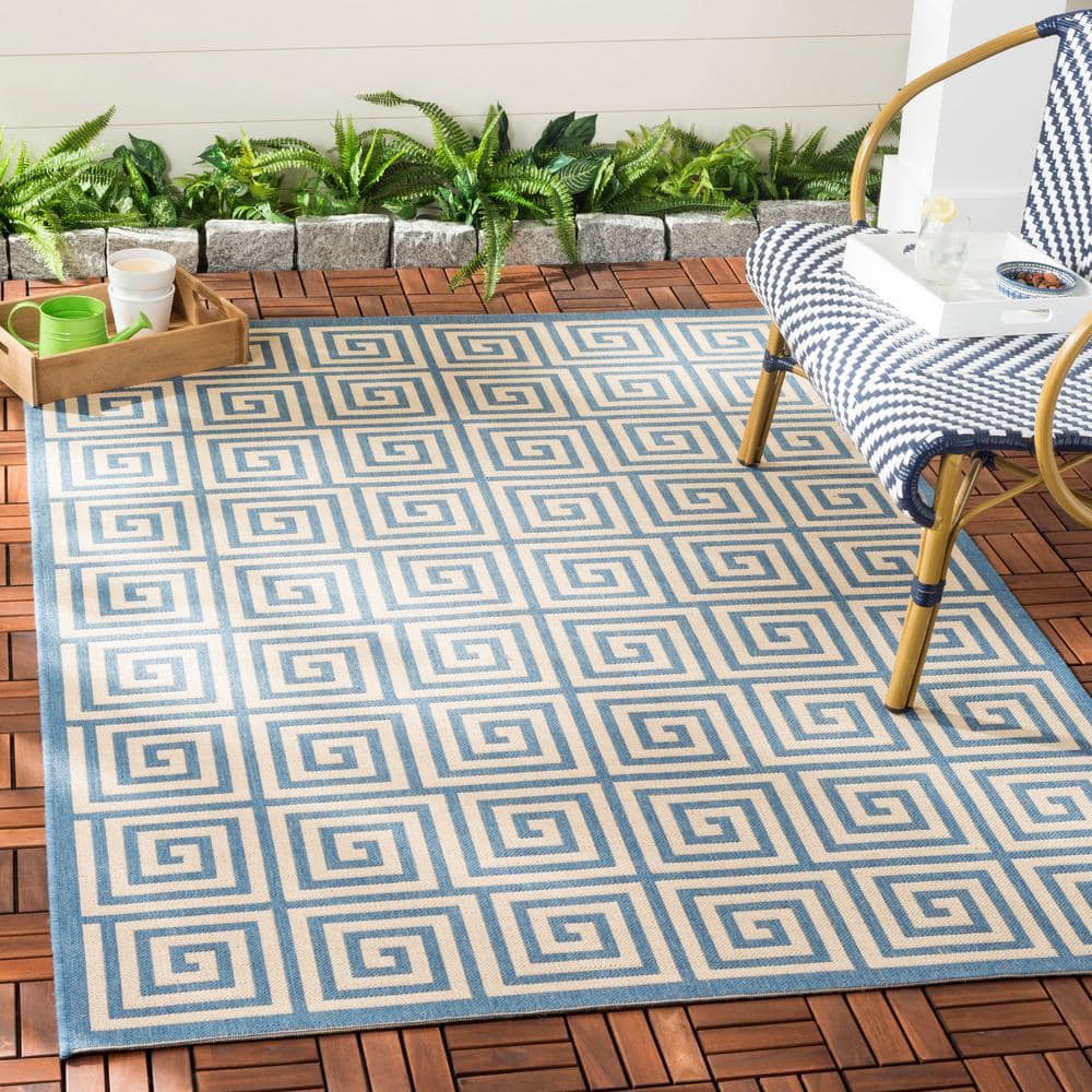 Cream and Blue Geometric 3' x 5' Stain-Resistant Synthetic Rug