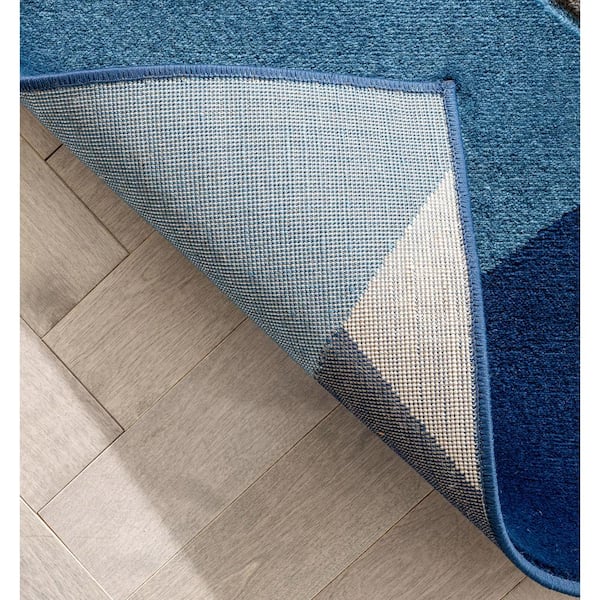 https://images.thdstatic.com/productImages/62a3c165-38a5-48f6-83a9-80c4df414ae5/svn/blue-well-woven-area-rugs-gv-84-4-1f_600.jpg