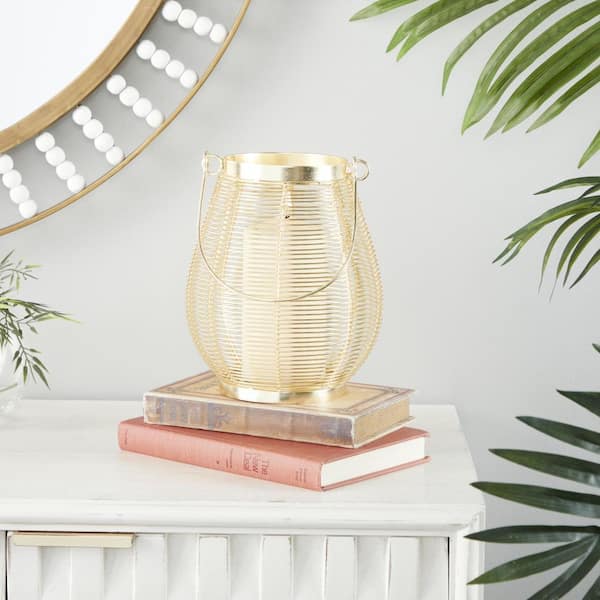 Litton Lane 9 in. H Gold Metal Decorative Candle Lantern with Thin Metal Handle