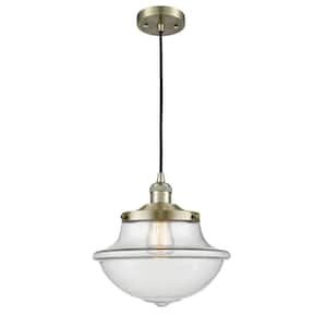 Oxford 1 Light Antique Brass Schoolhouse Pendant Light with Clear Glass Shade