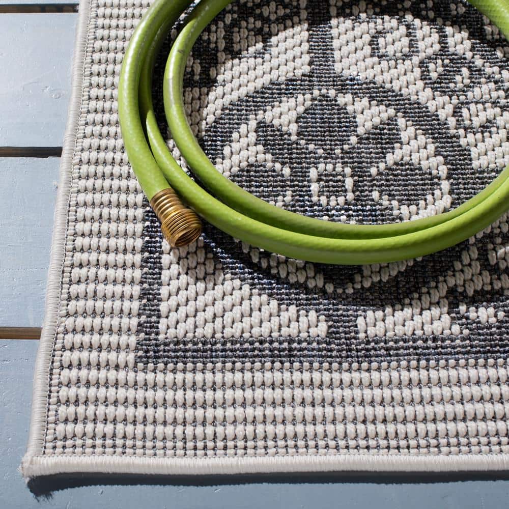 Ivory & Charcoal Geometric 8' x 10' Easy-Care Synthetic Area Rug