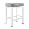 Single light grey cushioned bar stool with white frame.