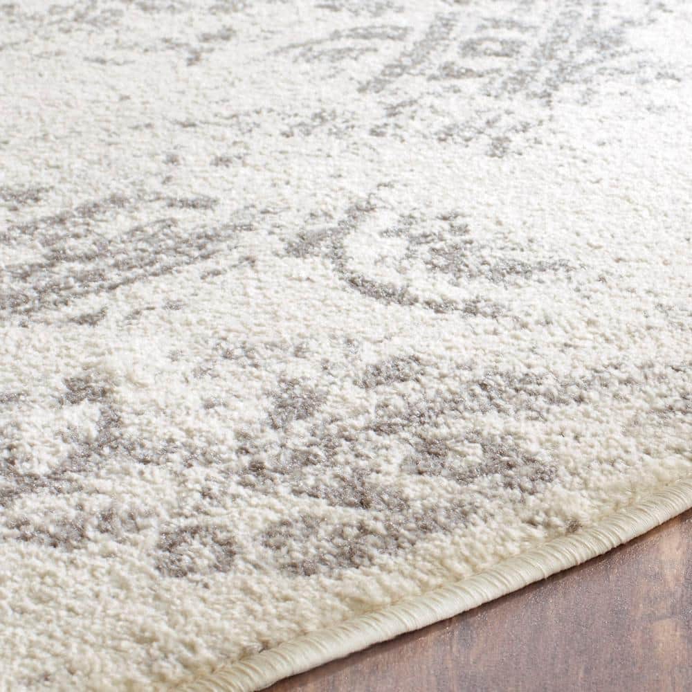 Chic Ivory & Silver 6' Round Synthetic Easy-Care Area Rug