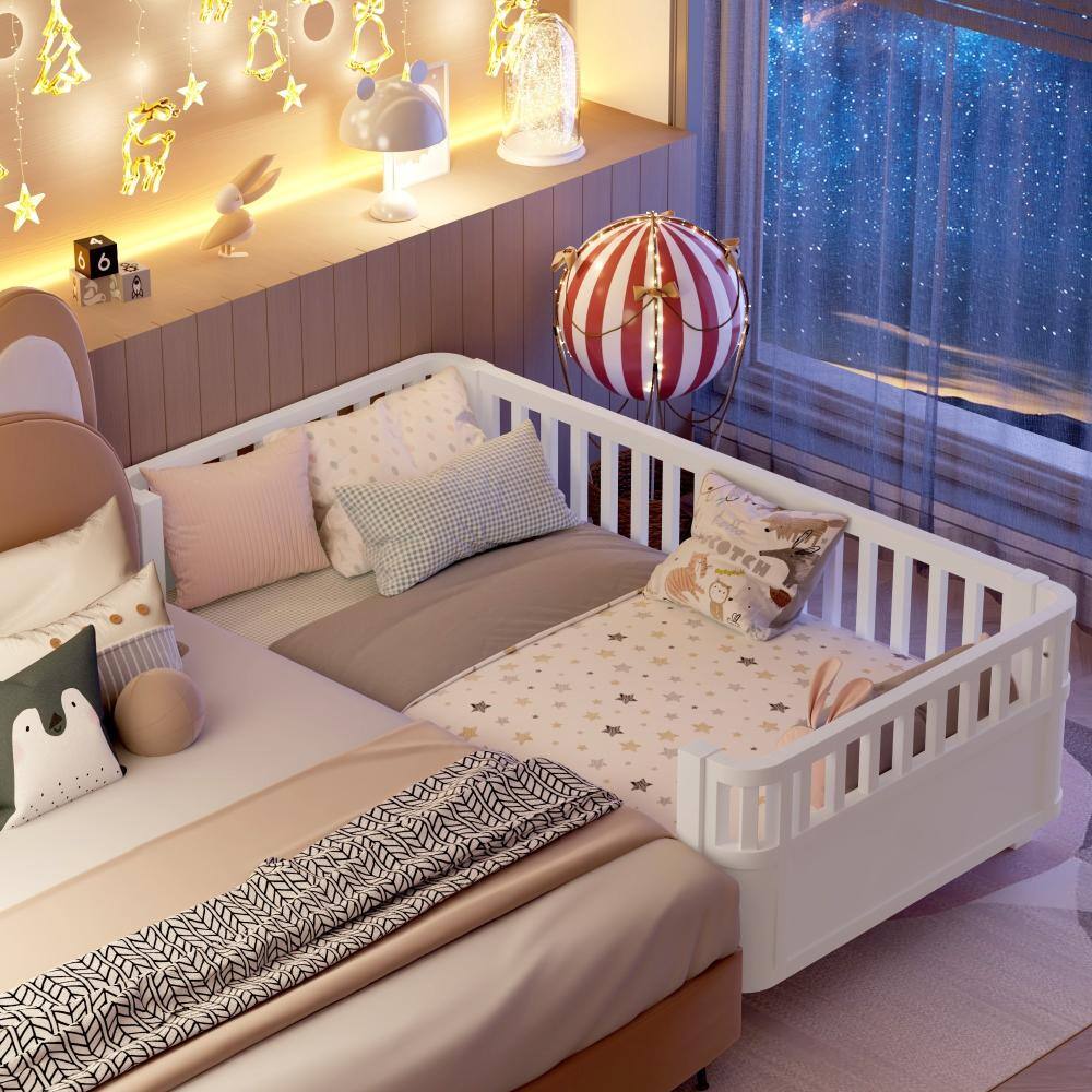 Bedroom scene with a white twin bed decorated with stars and a striped lampshade.