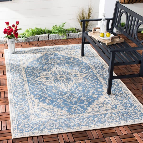 https://images.thdstatic.com/productImages/6365cb09-ac0d-4833-9174-a2bc29fd0bf8/svn/blue-cream-safavieh-outdoor-rugs-bhs137m-9-e1_600.jpg