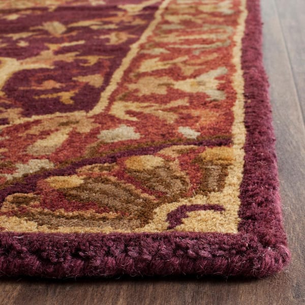 https://images.thdstatic.com/productImages/637a350c-bf41-4480-9c8f-7a7547ed7017/svn/burgundy-safavieh-area-rugs-em459b-212-1f_600.jpg