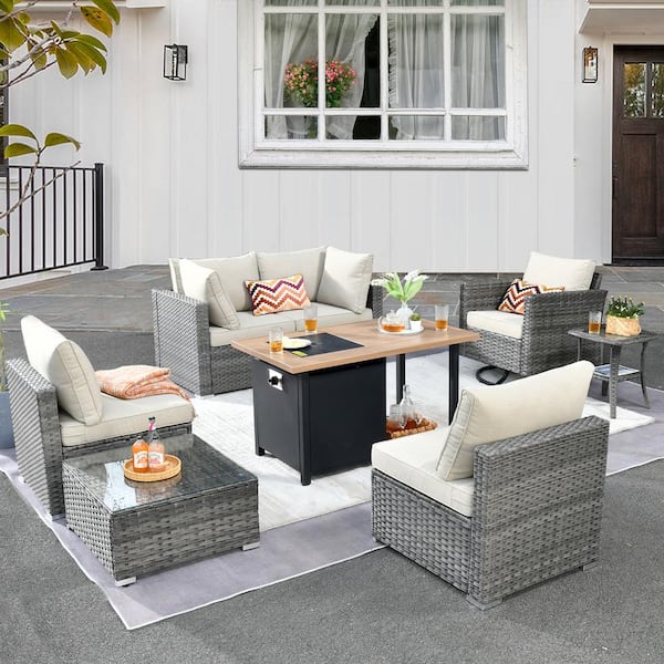 weaxty W Daffodil Y Gray 8-Piece Wicker Patio Storage Fire Pit Conversation Set with a Swivel Rocking Chair and Beige Cushions