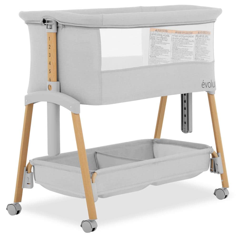 Light Gray Lullaby Portable Bassinet with wheels