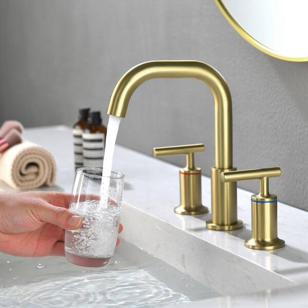 https://images.thdstatic.com/productImages/63a8545d-ea5a-43bd-99a0-3b52c80590ce/svn/brushed-gold-aurora-decor-widespread-bathroom-faucets-dbfsmdhd2b06bg-c3_600.jpg