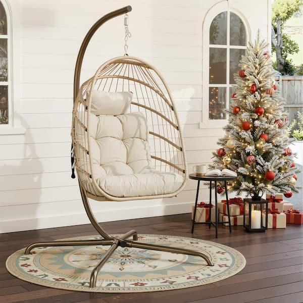 FINCATI 1-Person 350 lbs. Capacity Foldable Beige Wicker Egg Porch Swing Chair with Steel Stand and Beige Cushion for Patio