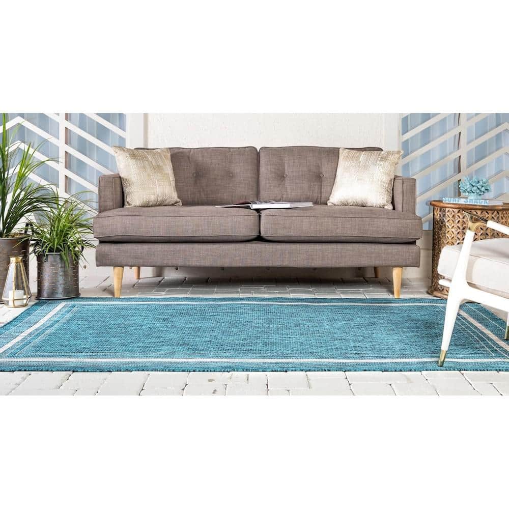 5' x 8' Teal Blue and Beige Flat Woven Outdoor Area Rug