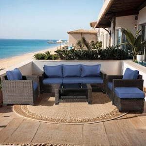 Brown 7-Piece Wicker Outdoor Sectional Set with Dark Blue Cushions and Table