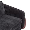 Three-quarter view of black upholstered sofa with wood legs.