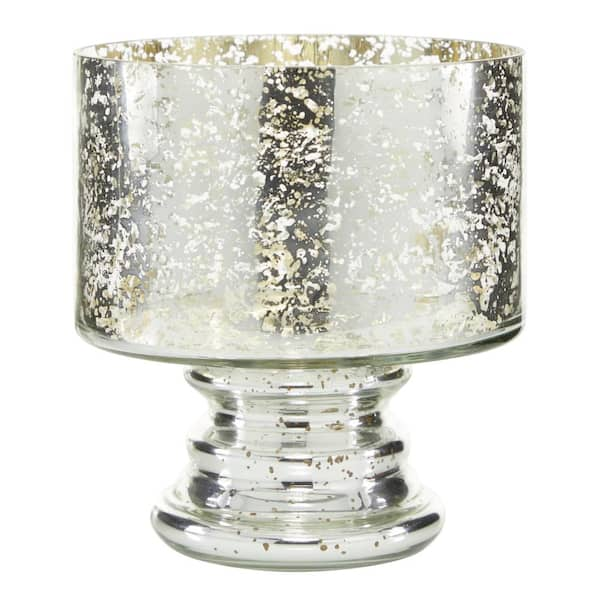 https://images.thdstatic.com/productImages/63d1fcd7-e7b4-4a3f-900e-8c3fc06194b0/svn/silver-litton-lane-candle-holders-24669-e1_600.jpg