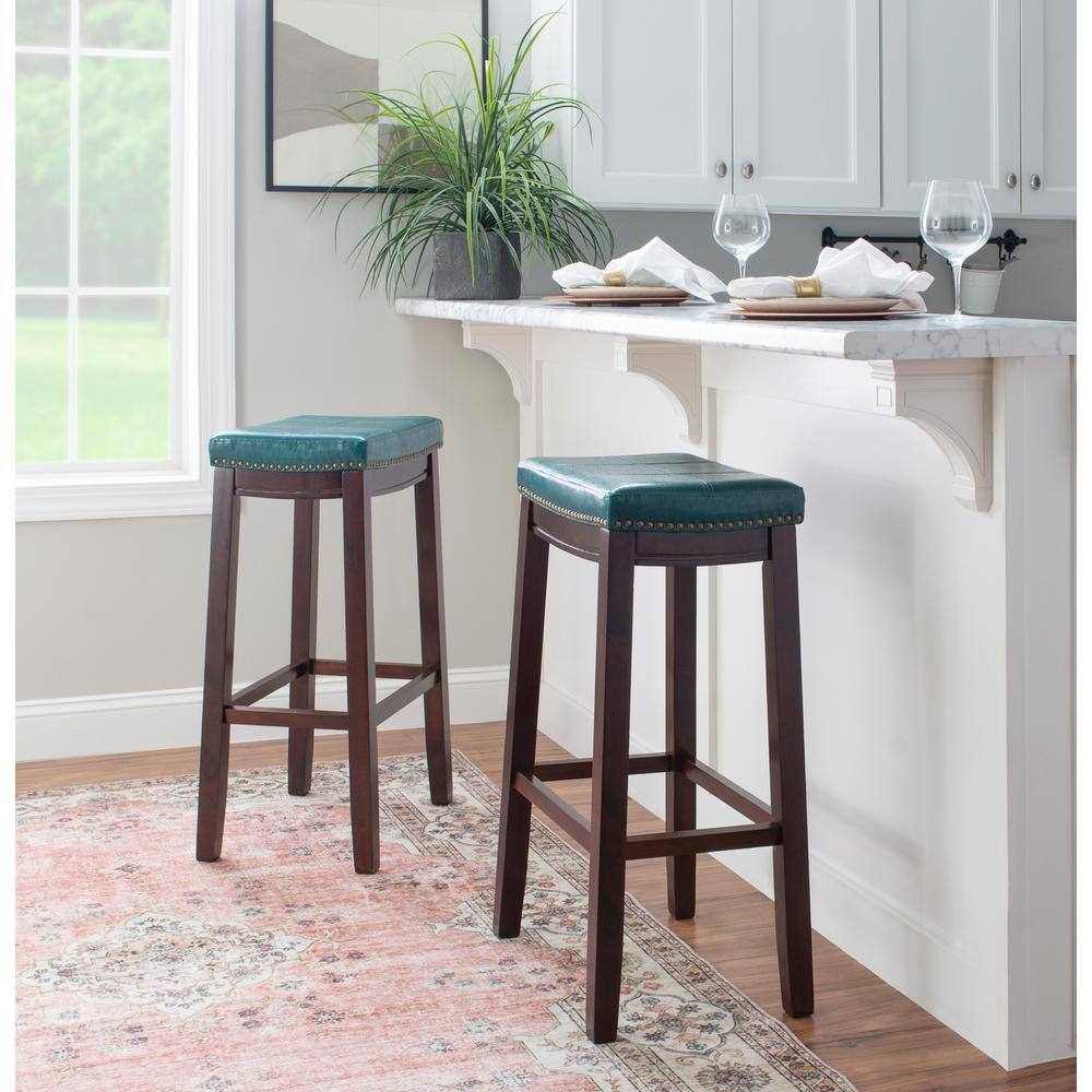 Claridge Dark Brown & Blue Faux Leather 32" Backless Saddle Bar Stool