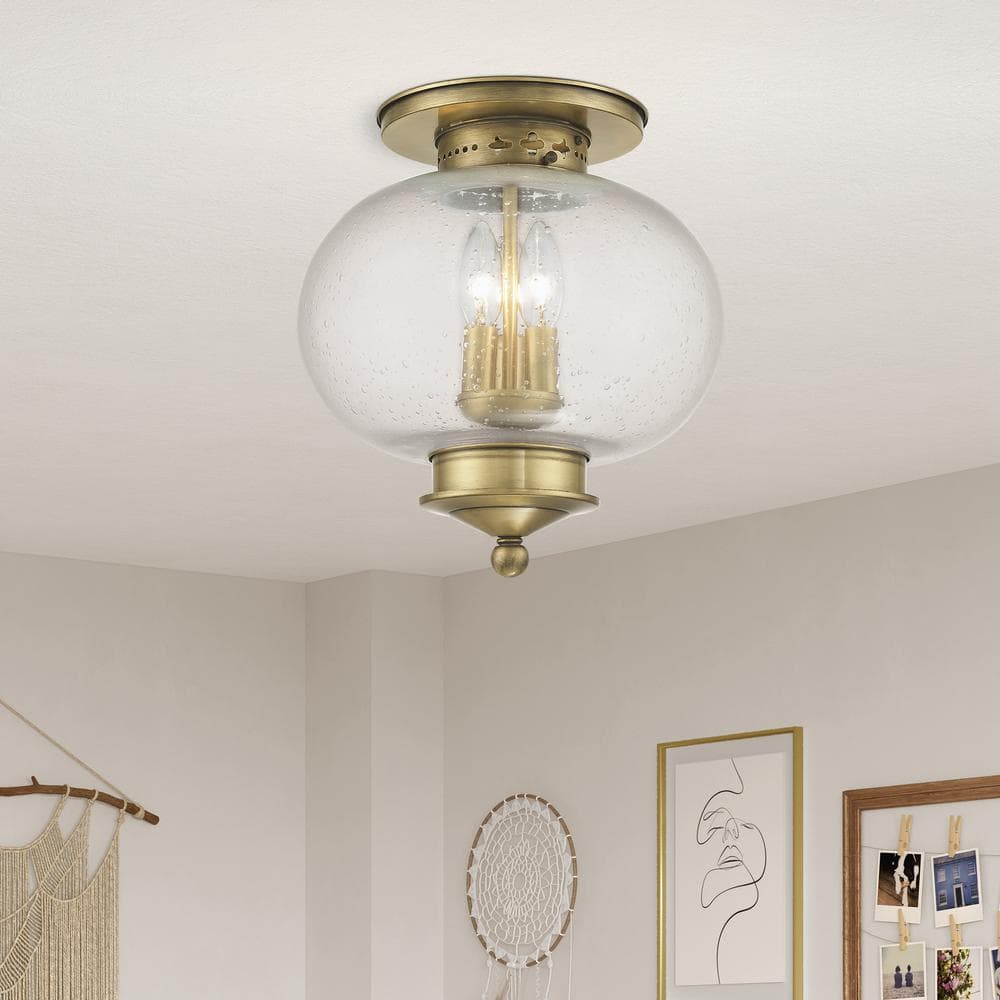 Harbor Antique Brass Globe LED Flush Mount with Hand Blown Seeded Glass