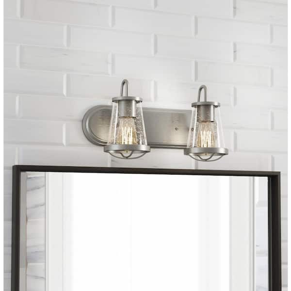 Georgina 18 in. 2-Light Brushed Nickel Industrial Rustic Vanity with Clear Seeded Glass Shades and Cage Accents