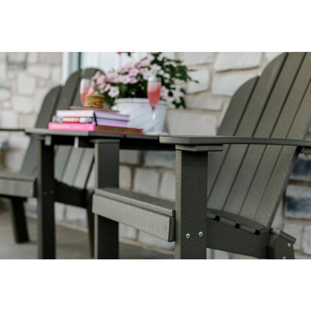 Outdoor dining set with dark gray outdoor chairs and table on a patio.