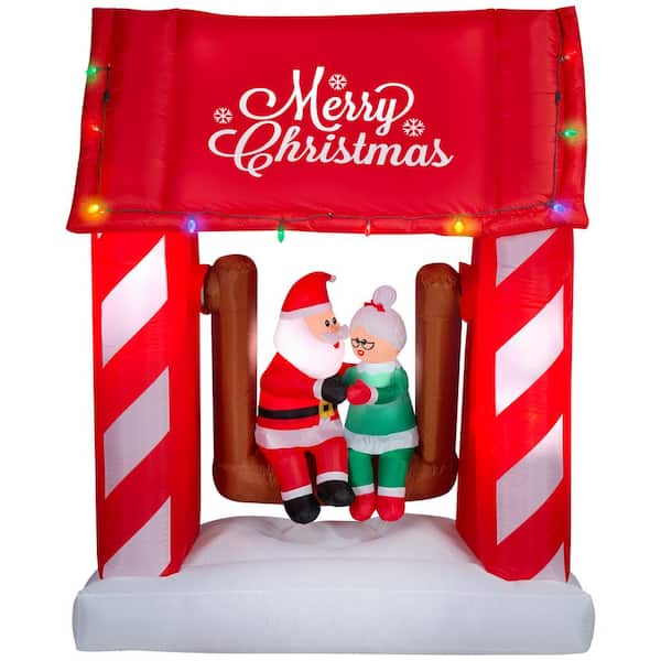Unbranded 7 ft. Tall x 5.6 ft. Wide Christmas Inflatable Animated Airblown-Mr. and Mrs. Claus Porch Swing Scene
