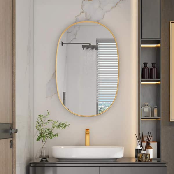ANGELES HOME 24 in. W x 36 in. H Oval Framed Wall Bathroom Vanity Mirror in Brushed Gold