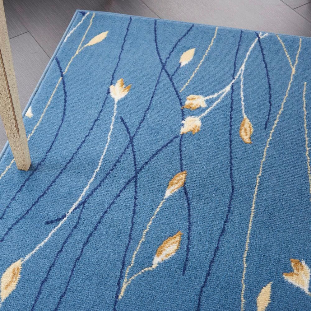 Light Blue Floral Synthetic 5' x 7' Area Rug