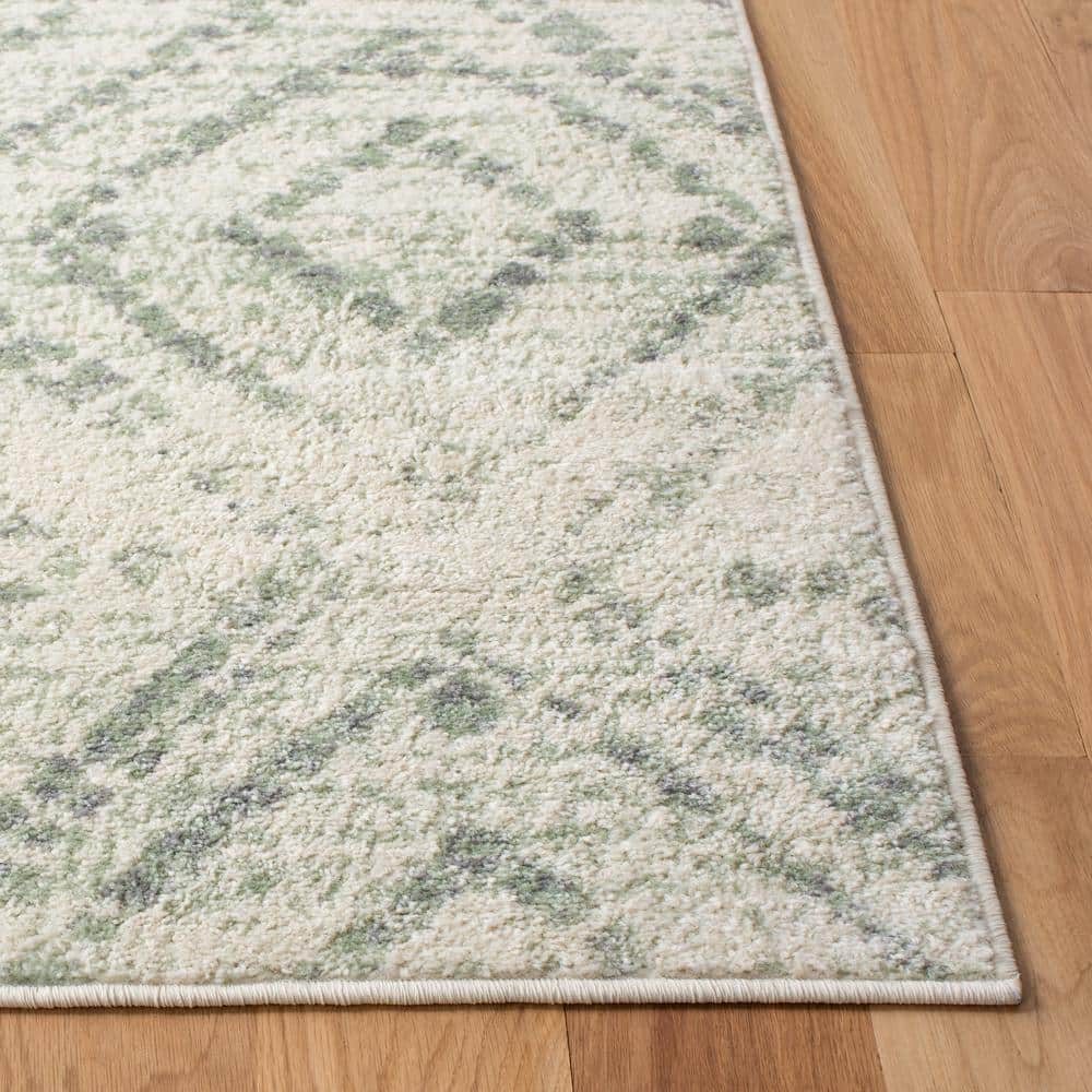 Ivory and Green Geometric 10' x 14' Synthetic Area Rug