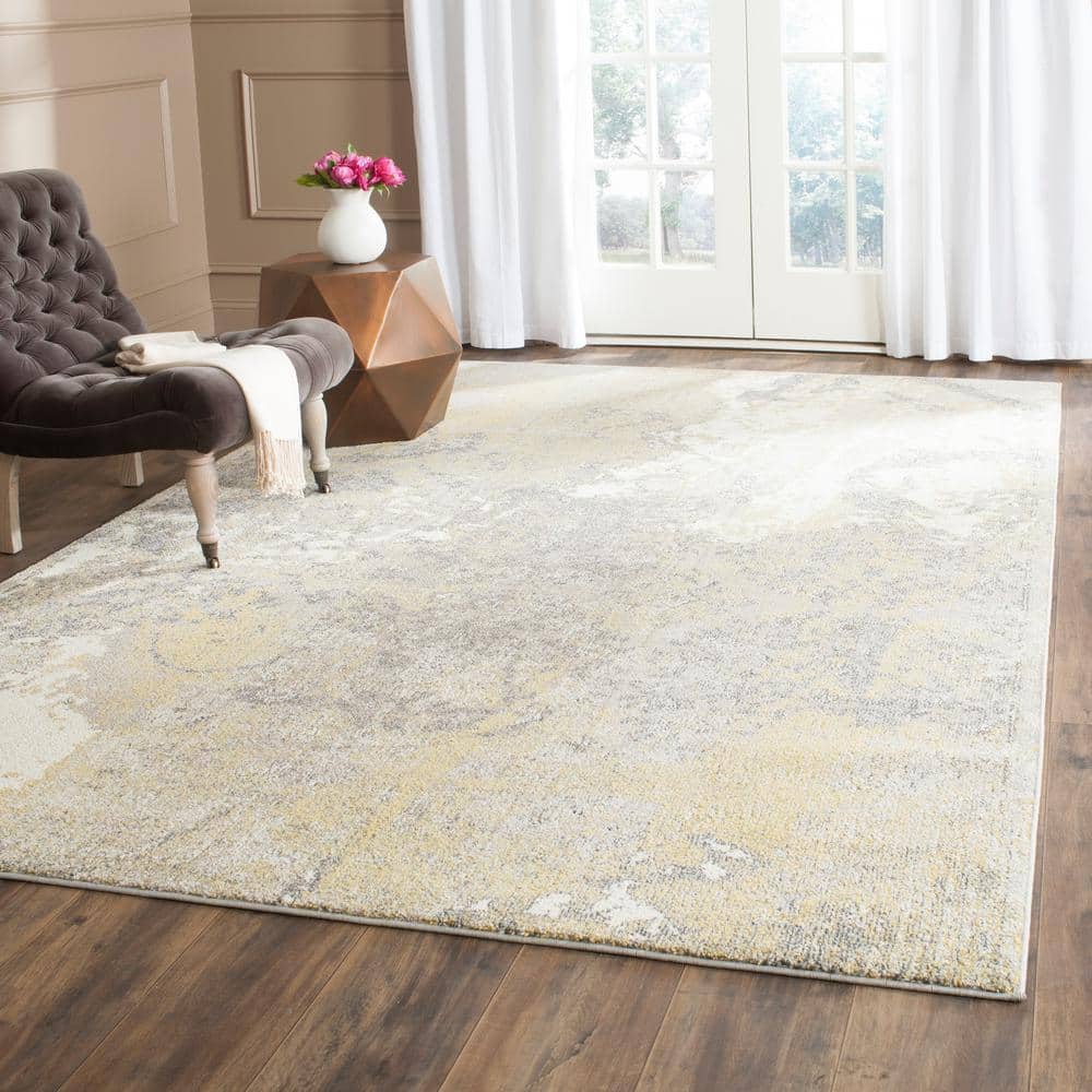Ivory and Gray Abstract 9' x 12' Synthetic Area Rug