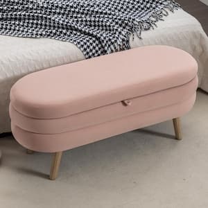 Faye Light Pink Velvet Modern Oval Storage Ottoman With Wood Legs