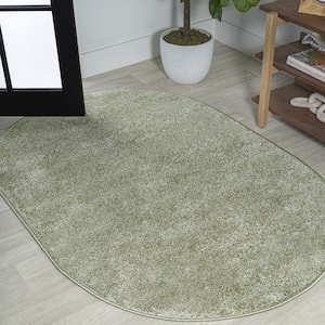 Haze Solid Low-Pile Green 3 ft. x 5 ft. Oval Area Rug