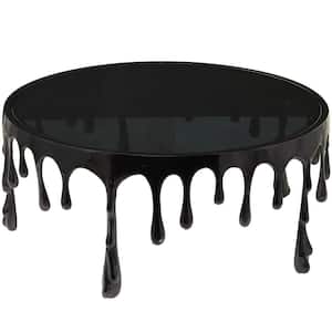 36 in. Black Medium Round Aluminum Drip Coffee Table with Melting Designed Legs and Shaded Glass Top