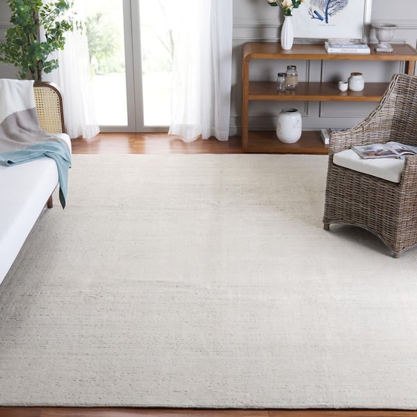 Mirage 9 ft. x 12 ft. Ivory Solid Color Area Rug