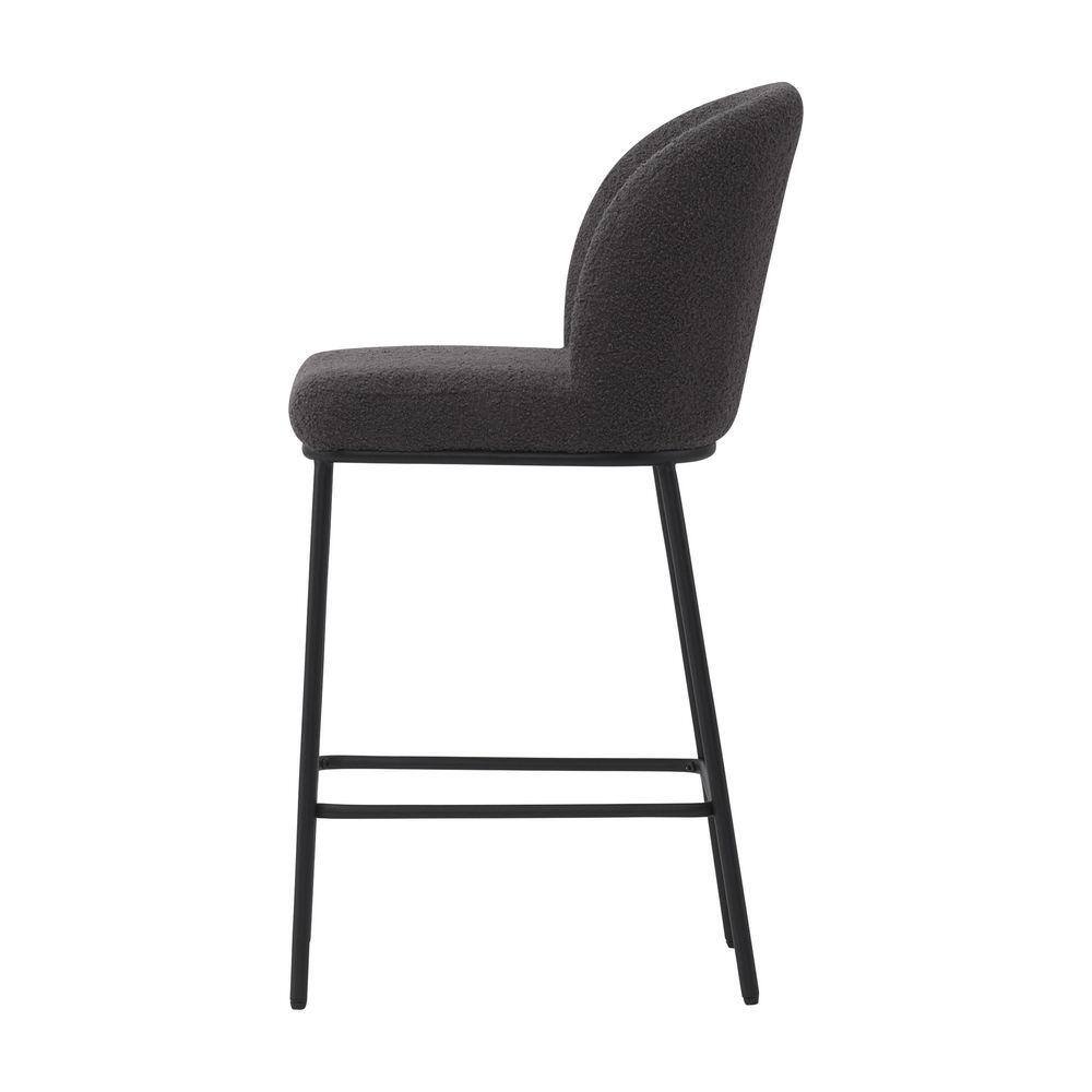 Side view of a grey boucle upholstered bar stool with a black metal frame.