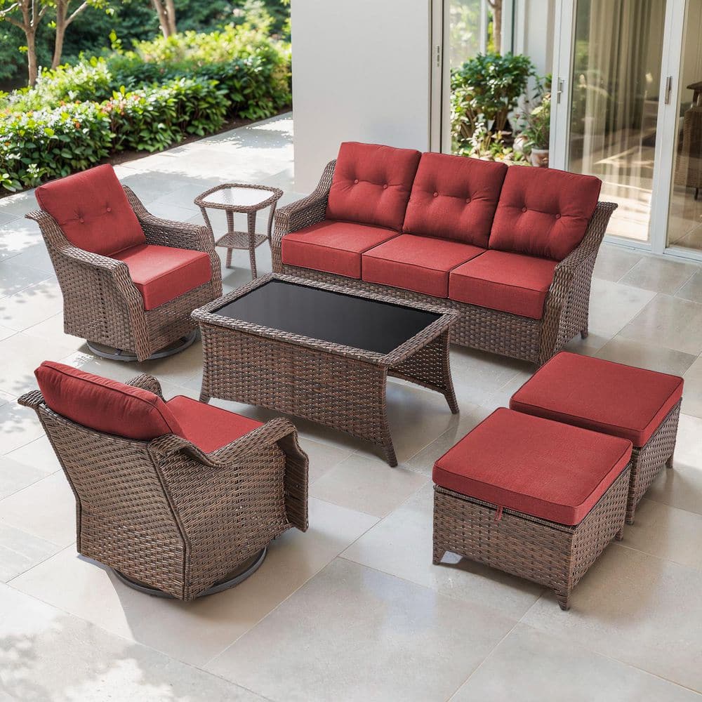 Artisan 7-Piece Brown Wicker Patio Conversation Set with 2-Swivel Gliders, Coffee Table, 2-Ottomans and Red Cushions