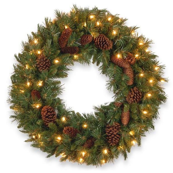 National Tree Company 24 in. Pine Cone Artificial Wreath with Clear Lights