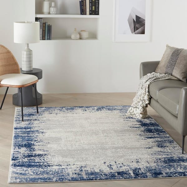 https://images.thdstatic.com/productImages/6558987d-db36-5098-bd69-460db882518e/svn/ivory-navy-nourison-area-rugs-795762-4f_600.jpg