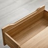 Close-up of an open bamboo drawer.