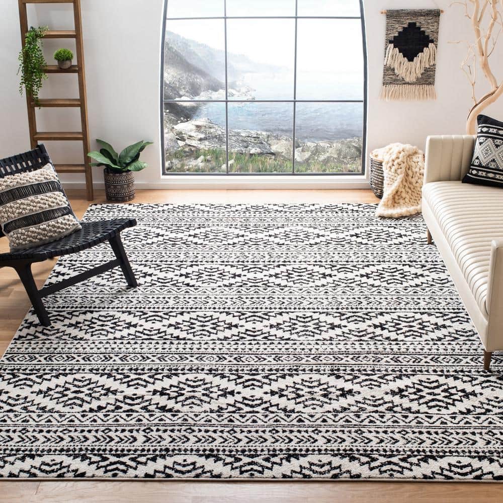 Ivory and Black Geometric Synthetic 9' x 12' Area Rug