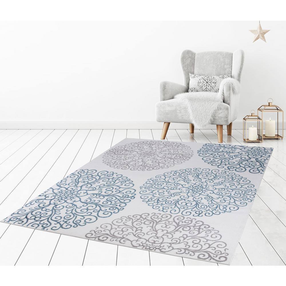 Ivory Elegance 5'3" x 7'3" Synthetic Medallion Area Rug