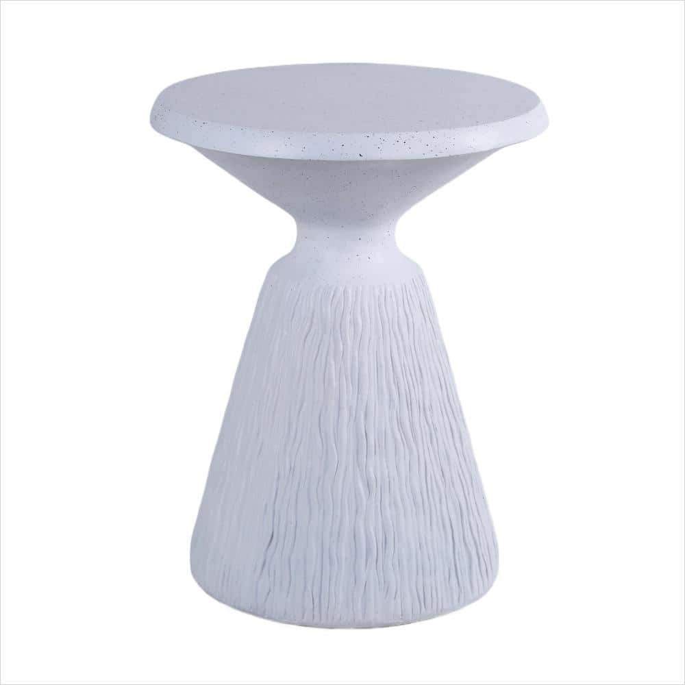 Modern round end table with white speckled top and fluted base.