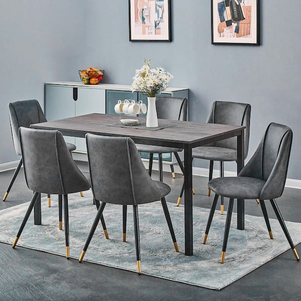 https://images.thdstatic.com/productImages/65c71cbb-7c7f-4193-9ab4-d2f8166e41f1/svn/charcoal-grey-dining-chairs-smeg-dining-charcoal-leathaire-black-gol-31_600.jpg