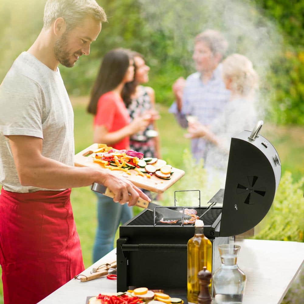 Compact Black Steel Portable Charcoal Grill with Warming Rack