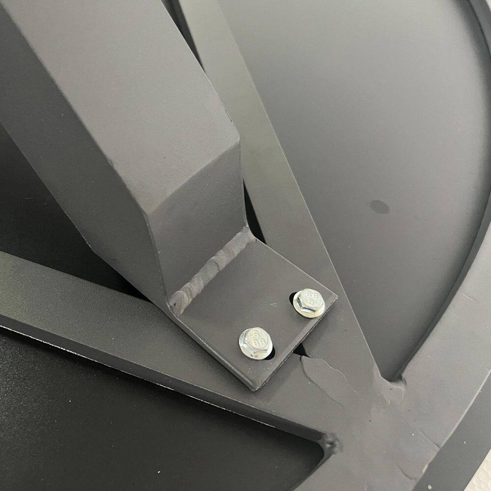 Close-up of the metal connection point on the table base.