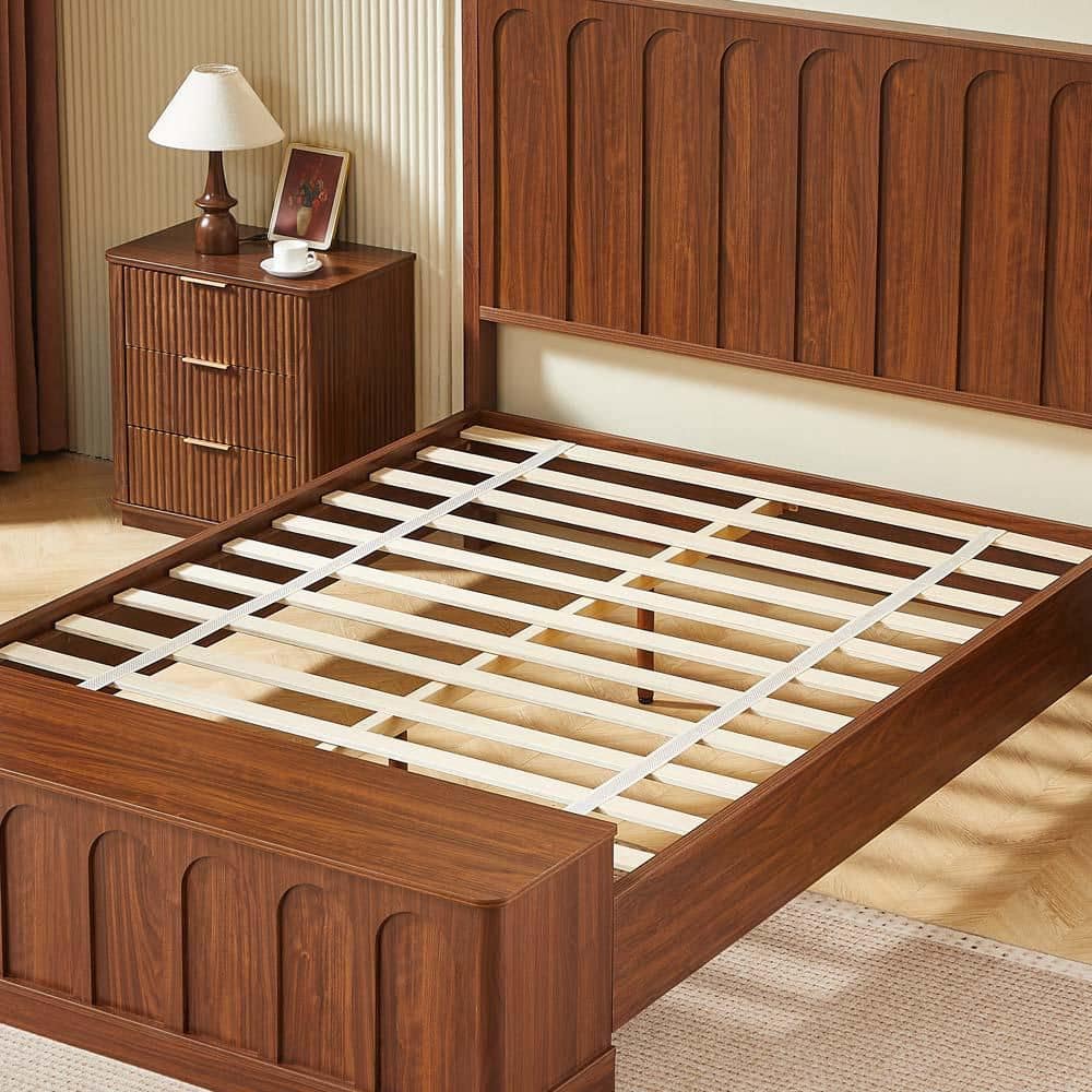 Close-up of the walnut brown bed frame showing the slat support system.
