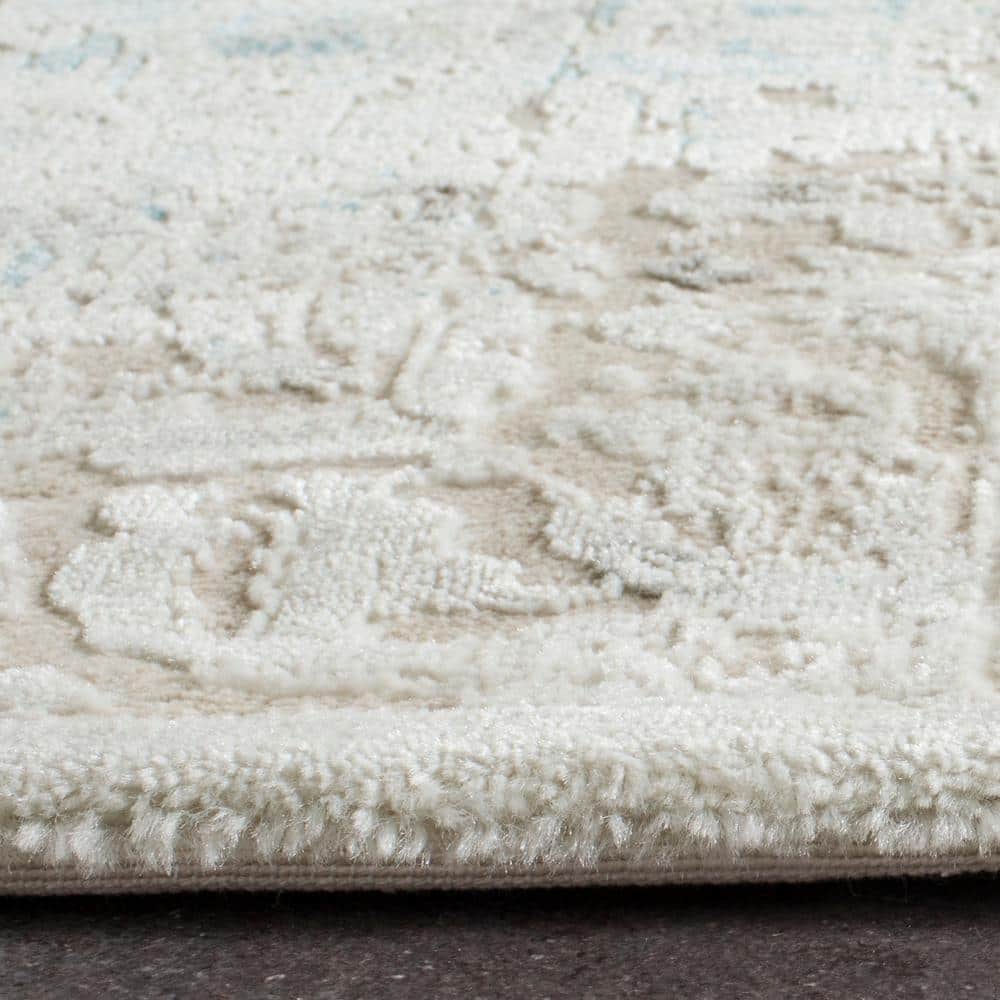 Ivory and Turquoise 9' x 12' Vintage Distressed Area Rug