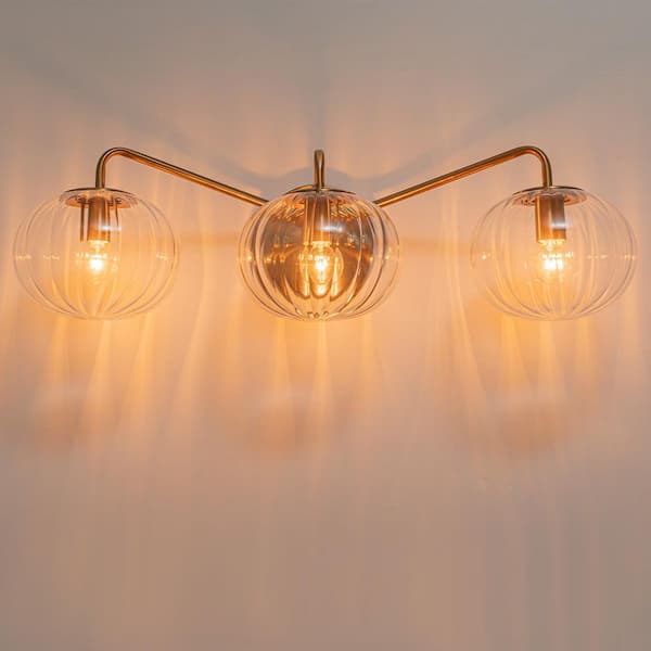 Lila 23.23 in. 3-Light Brass Bathroom Vanity Light with Clear Global Ribbed Glass Shades