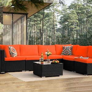 7-Piece Wicker Outdoor Sectional Set with Orange Cushions and Coffee Table