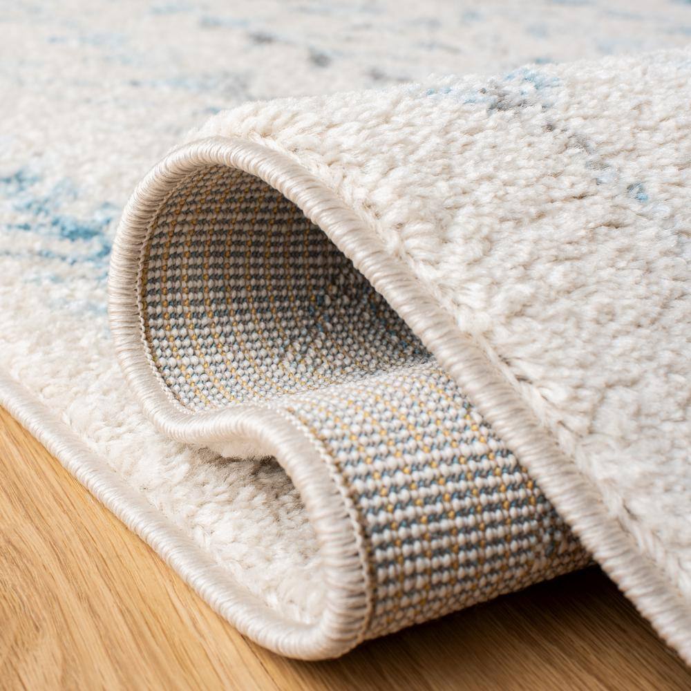 Ivory & Turquoise Boho-Chic 9' x 12' Hand-Knotted Synthetic Area Rug