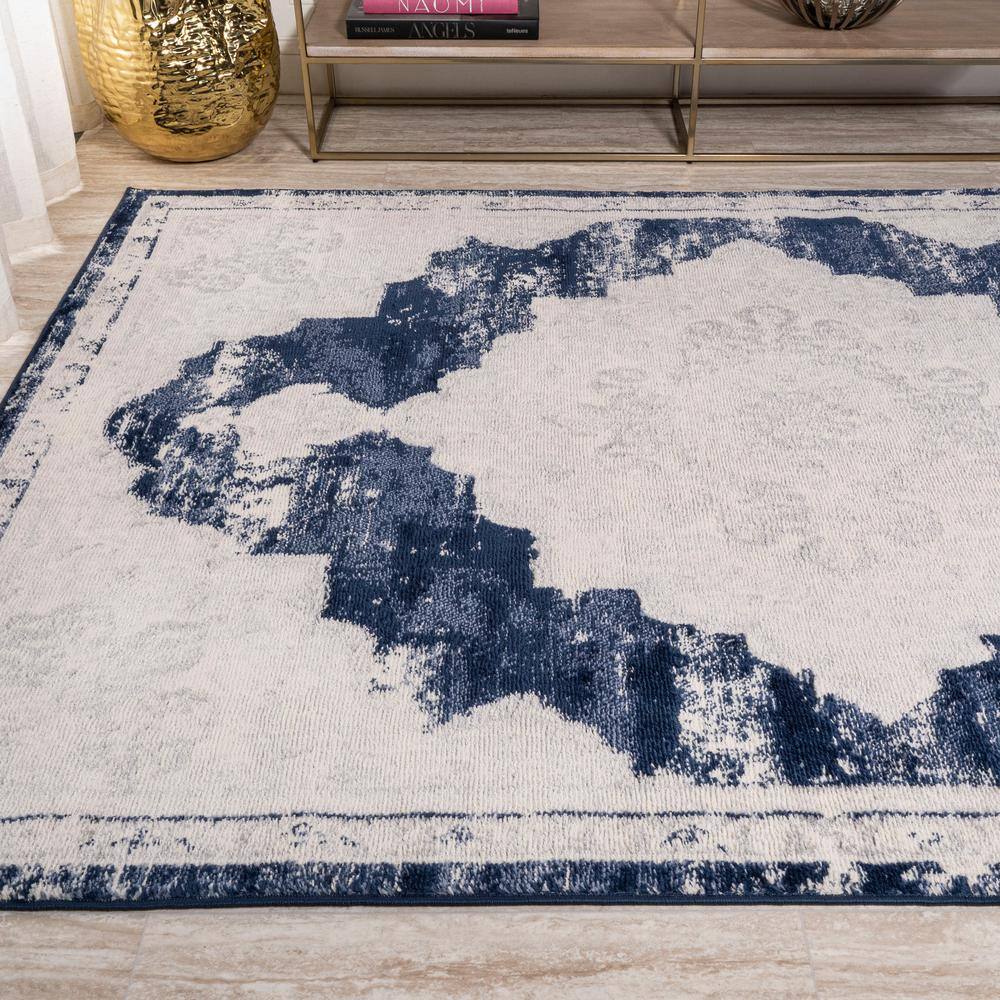 Ivory and Navy Synthetic Reversible Medallion Area Rug