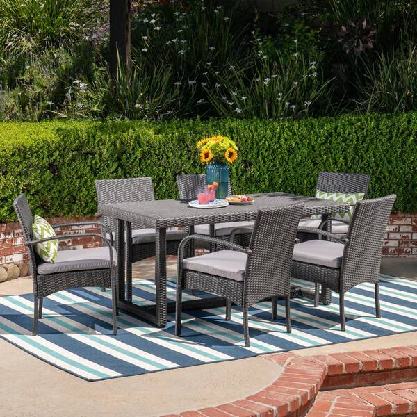 Noble House Harlowe Grey 7-Piece Faux Rattan Rectangle 28 in. Outdoor Dining Set with Grey Cushions