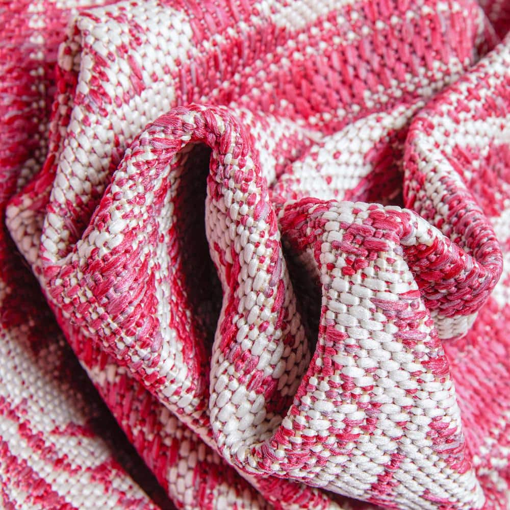 Fuchsia and White Synthetic 5' x 7' Reversible Area Rug